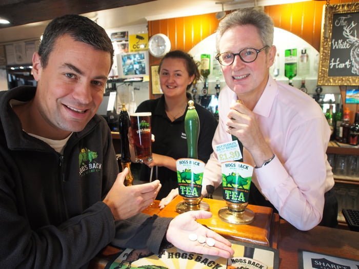 at the White Hart in Tongham, (l-r) Miles Chesterman, Hogs Back head brewer; pub team member Gemma Elstob and Hogs Back MD Rupert Thompson