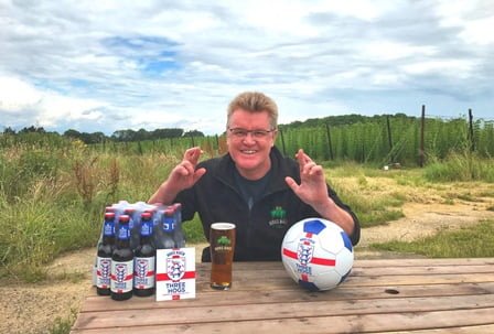 Gordon Thompson, Hogs Back Brewery sales director, has everything crossed for England's success on Sunday. Photo taken at the Brewery Tap, overlooking their hop garden.