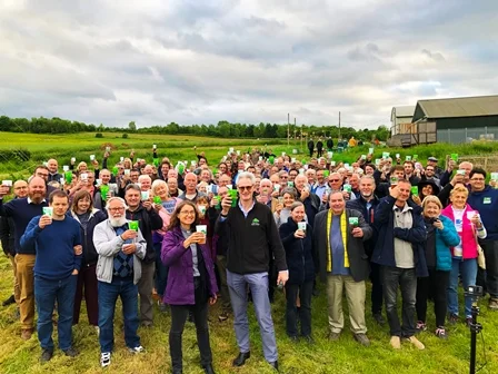 Raising a glass at the Hogs Back Brewery hop blessing led by (front) Rev. Claire Holt of St Paul’s Church, Tongham and Hogs Back managing director Rupert Thompson