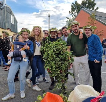 Party guests take part in the hat decorating competition