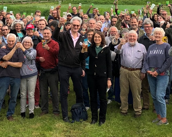 Guests raise a glass at the Hogs Back Brewery Hop Blessing, with managing director Rupert Thompson and Claire Holt (centre)